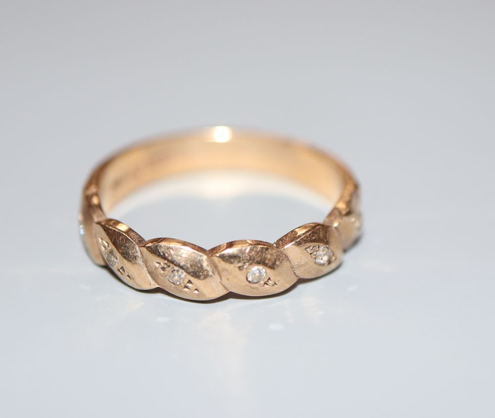 A modern 9ct gold and diamond chip set ring, size N, gross 2.6 grams.